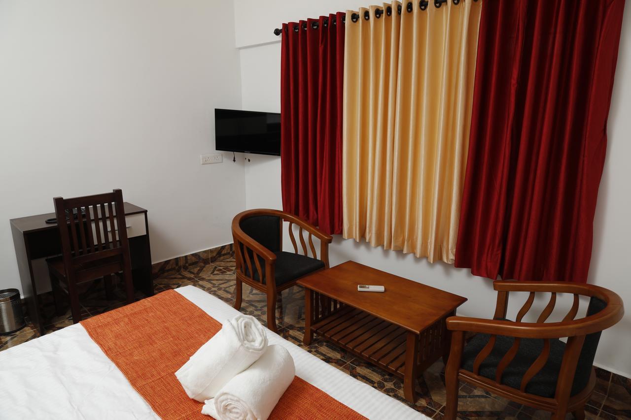 Puthens Clifton Inn Kottayam Dış mekan fotoğraf